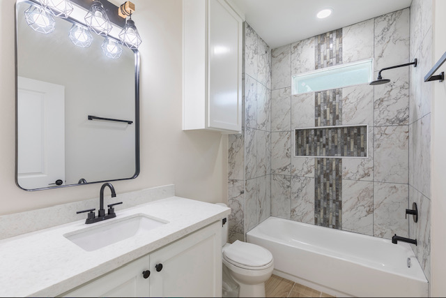 Bath with tub and marble-look tile