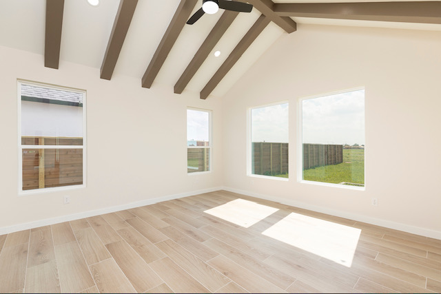 Vaulted bedroom with wood beams
