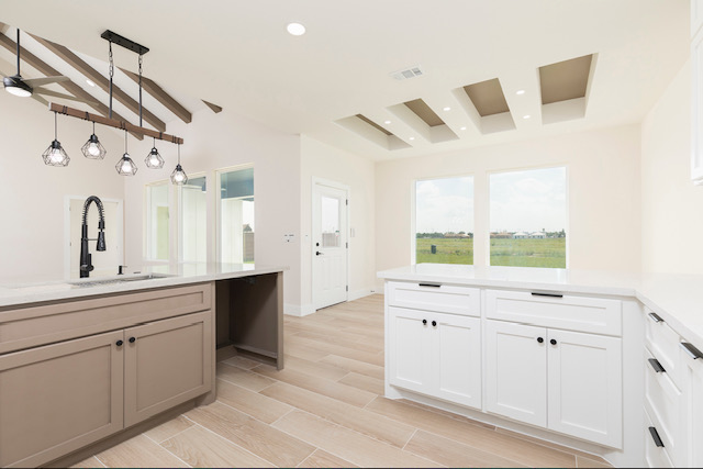 Kitchen islands toward the rear windows