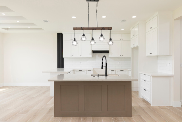 Kitchen island and white cabinetry