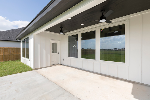 Covered patio with wood ceiling and fans