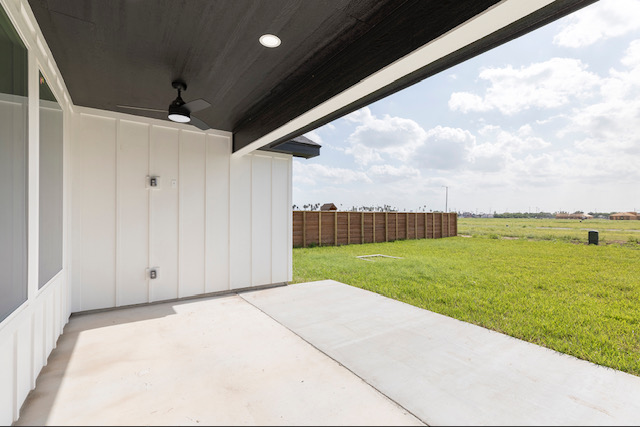 Covered rear patio opening to the lawn